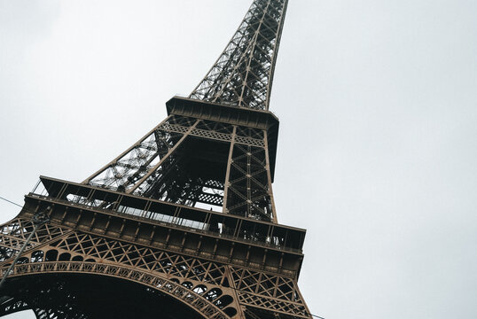 Eiffel Tower under a cloudy Parisian sky