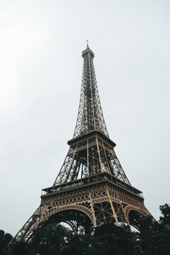 Eiffel Tower under a cloudy sky in modern Paris