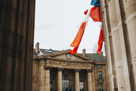 Historic architecture with French flags in Paris