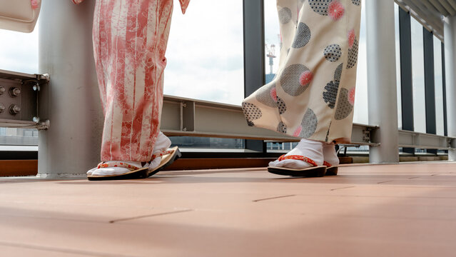 Japanese kimono feet in Tokyo on modern balcony walkway
