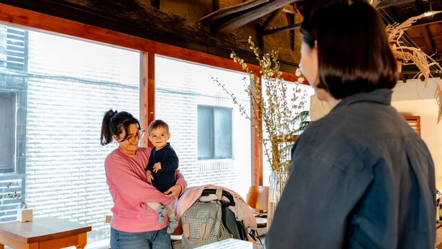 Mother and child joy in South Korean coffee shop