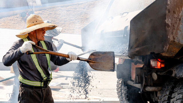Workers doing asphalt paving in Gyeongju, South Korea