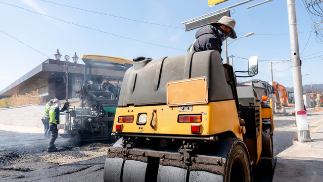 Asphalt paving work on urban South Korean street