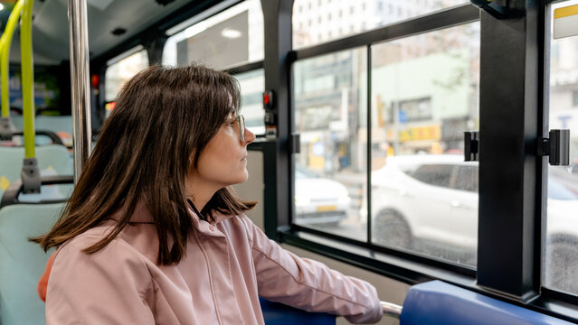Woman traveling by bus in Seoul, South Korea