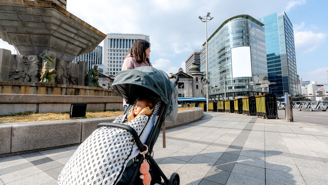 Urban life in Myeongdong, Seoul with baby stroller