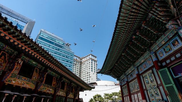 Jogyesa Temple and city skyline in Seoul