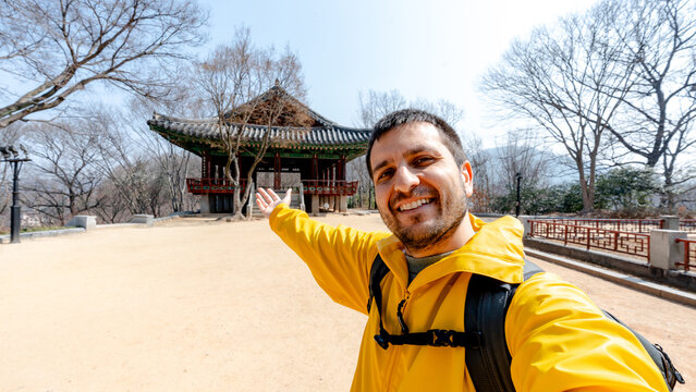 Traveler taking selfie at Pavilion Omokdae in Korea