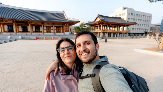 Couple taking selfie at Jeolla Gamyeong hanok courtyard