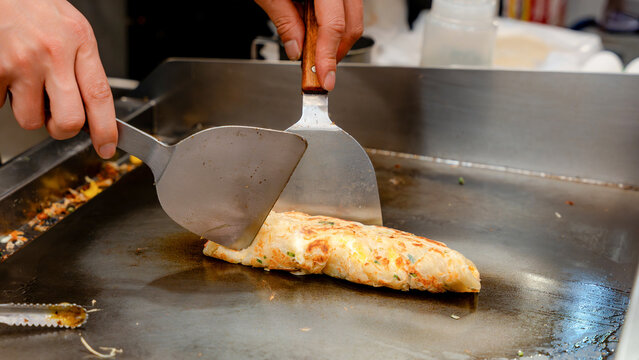 Taiwanese street vendor cooking scallion pancake at night