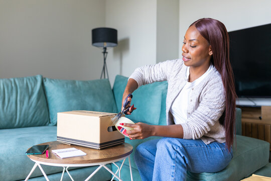 Black woman shipping a secondhand sale from her home