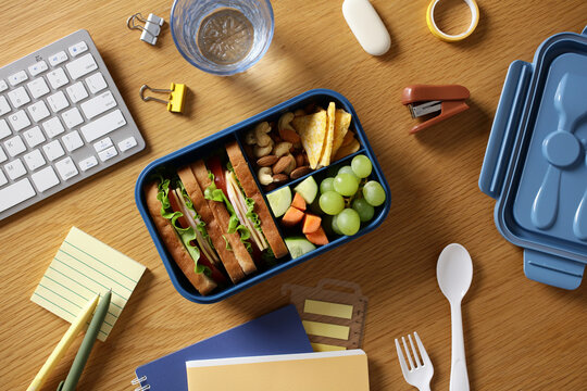 Healthy bento lunchbox on desk for office wellness snack