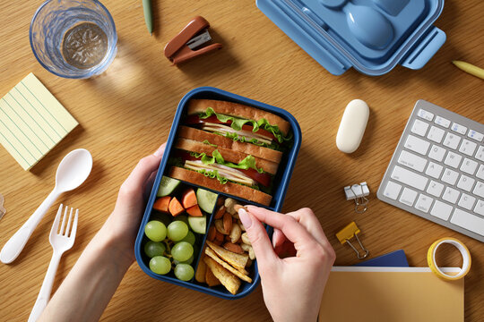 Healthy bento lunchbox on office desk for wellness break