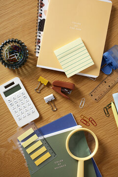 Contemporary office stationery flat lay on wooden desk