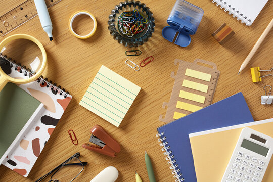 Modern office stationery flat lay on wooden desk top view