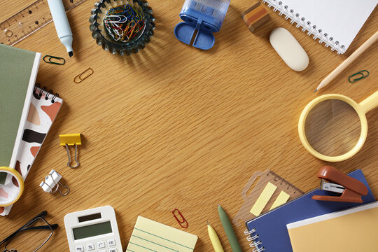 Contemporary home office stationery flat lay on wood desk