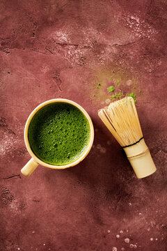 Matcha tea cup and whisk in zen wabi-sabi still life