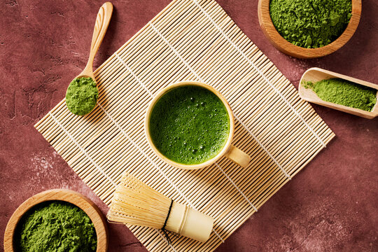 Ceremonial matcha tea with bamboo whisk in zen setting