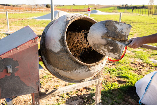 Concrete mixer pouring wet cement for outdoor construction