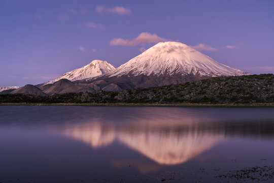 Parinacota Volcano reflected in lake at Andean dusk