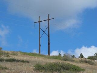 Fototapeta premium Power Lines and Utility Pole on Colorado Prairie Hillside