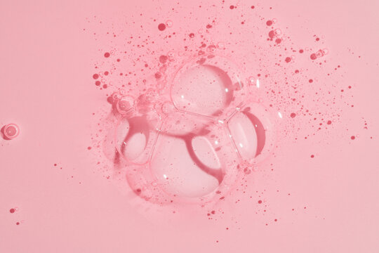 Pink gel shower texture background with bubbles and foam