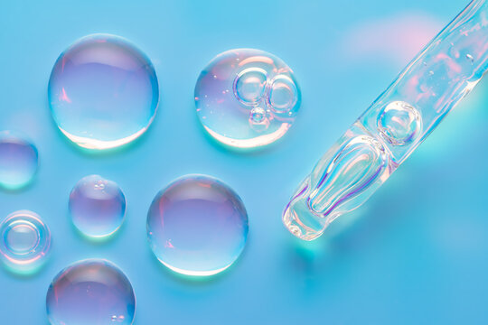 Macro cosmetic serum drops with neon glow on blue surface