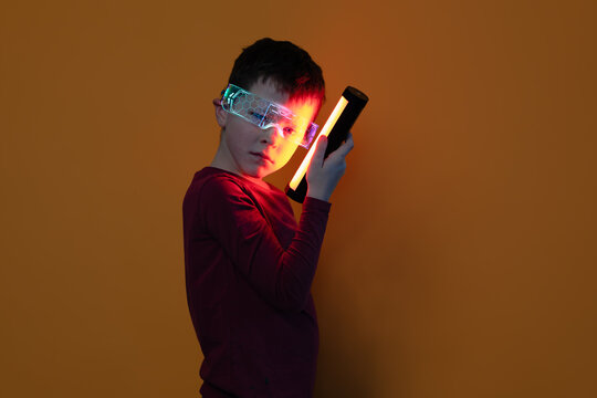 Kid wearing futuristic smart glasses exploring technology