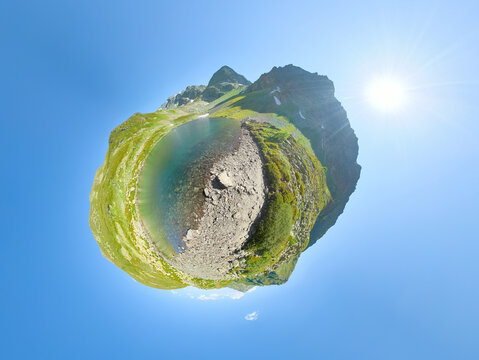 Tiny Planet Panorama of Multicolored Alpine Lake Surrounded by Green Mountains