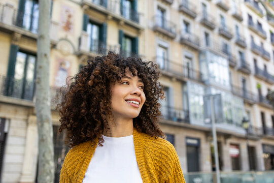 Hispanic woman enjoying urban lifestyle outdoors