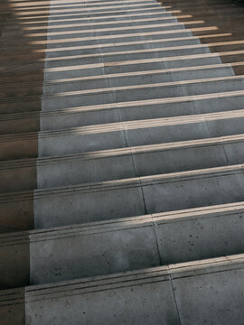 Abstract shadow pattern on concrete stairway steps