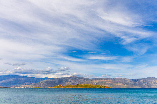 Small islet of Agios Athanasios (also known as Saint George or Agios Georgios) located in the bay of Galaxidi, Greece