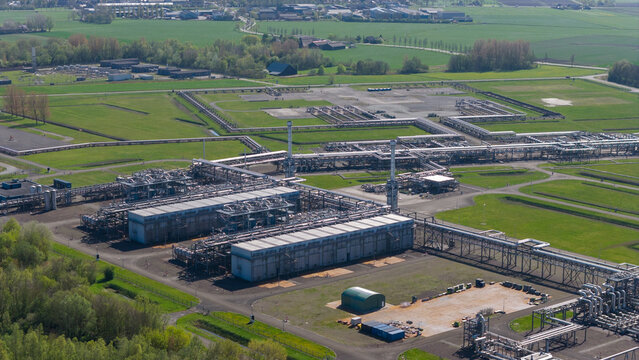 Aerial view of the NAM Grijpskerk UGS facility featuring industrial pipelines and storage infrastructure surrounded by green fields in Grijpskerk, Groningen, Netherlands.