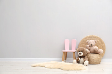 Toys, small chair and rug in child's room, space for text © New Africa