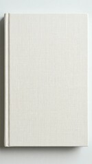 Naklejka premium Blank White Hardcover Book on Light Gray Surface