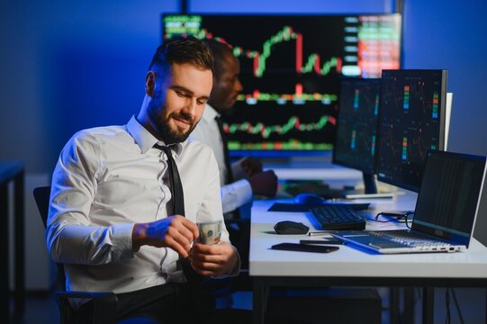 Holding Dollar bills in the stock market. Investor counting money after making it big on the stock market