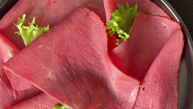 Beef ham thin slices of veal ham meat dish lunch or dinner tasty snack fresh, delicious, gourmet food background on the table rustic food close-up copy space
