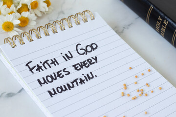 Naklejka premium Faith in God moves every mountain, inspirational text with mustard seeds and holy bible book. Belief and trust in Jesus Christ, biblical concept. Close-up.