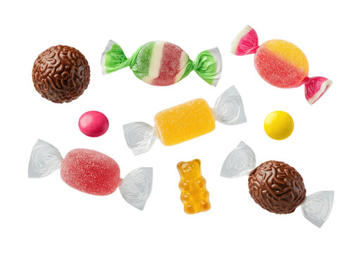 Assorted colorful wrapped candies and chocolate truffles scattered on a transparent background