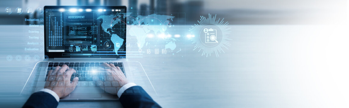 Quality lead working on laptop Assessment reports to evaluate system performance and compliance standards. Detailed analysis identifies key areas for improvement and operational excellence.
