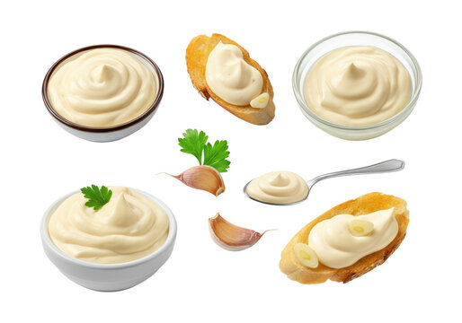 Creamy garlic mayonnaise and aioli presented in bowls, on crostini and a spoon, garnished with garlic cloves and parsley on a transparent background