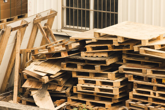 Stack of wooden pallets in industrial storage environment