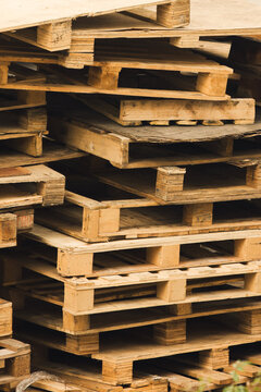Stack of wooden pallets in industrial storage environment