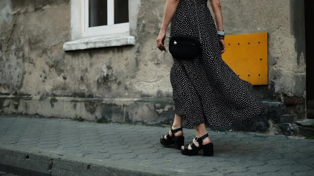 Stylish Young Woman Walks In The Historical Part Of A European City