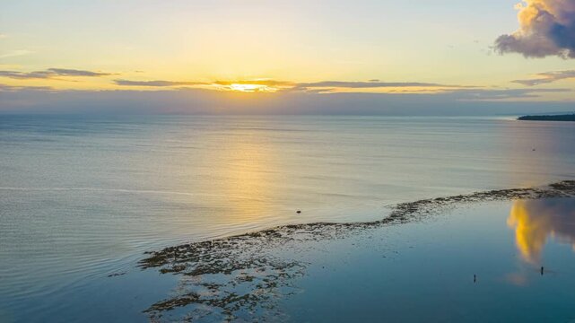 A Breathtaking View of the Shoreline, Coconut Trees, and the Sun Setting Over the Calm Sea at Mahaba Beach, Tangkaan, Padre Burgos, Southern Leyte, Philippines - Hyperlapse