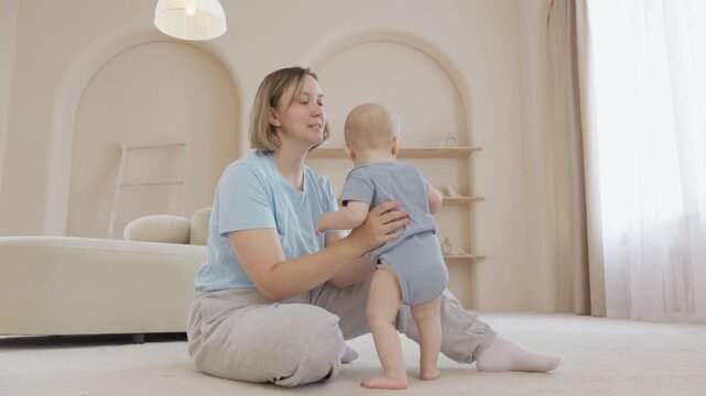 Caucasian baby taking tentative steps to mother on carpet with gentle support and encouragement, milestone moment in cozy nursery, smiles and loving embrace follow