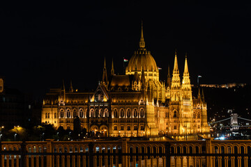 Fototapeta premium Hungarian Parliament Building Illuminated at Night Across the Danube, Budapest