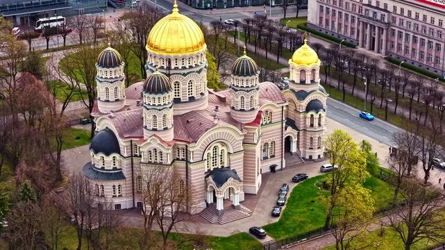Majestic orthodox Nativity of Christ Cathedral in Riga with golden domes in a city park