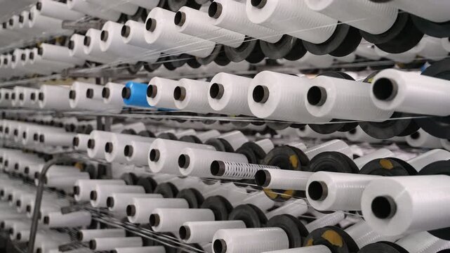 Textile factory weaving polypropylene threads into fabric
