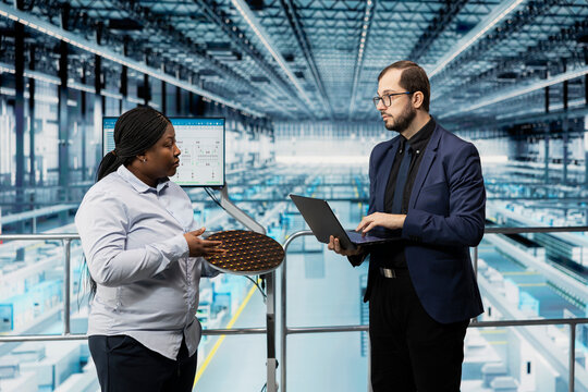 Planning smart factory predictive maintenance schedules, semiconductors and woman with manager. Managing industry 4.0 manufacturing plant operations, microchip silicon wafers and executives