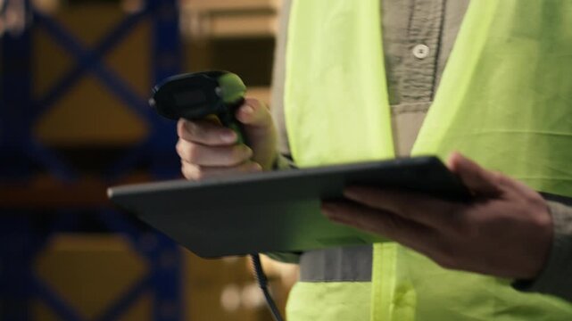 Professional staff scanning barcodes during order fulfillment process. Warehouse management system overseeing inventory for reliable e-commerce shipping and global delivery operations.